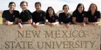 Image of group next to NMSU sign