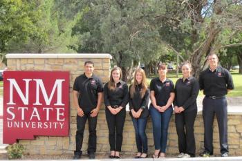 Image of group next to NMSU sign